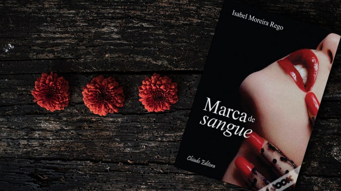 Marca de sangue Livro "Marca de Sangue" com flores vermelhas ao lado